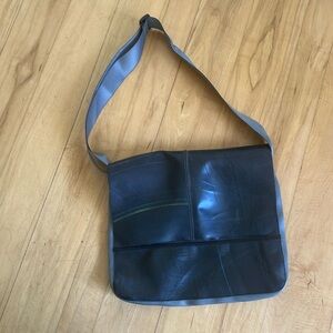 Recycled tire tube messenger bag. New without tags 13x15x2. Wide adjustablestrap